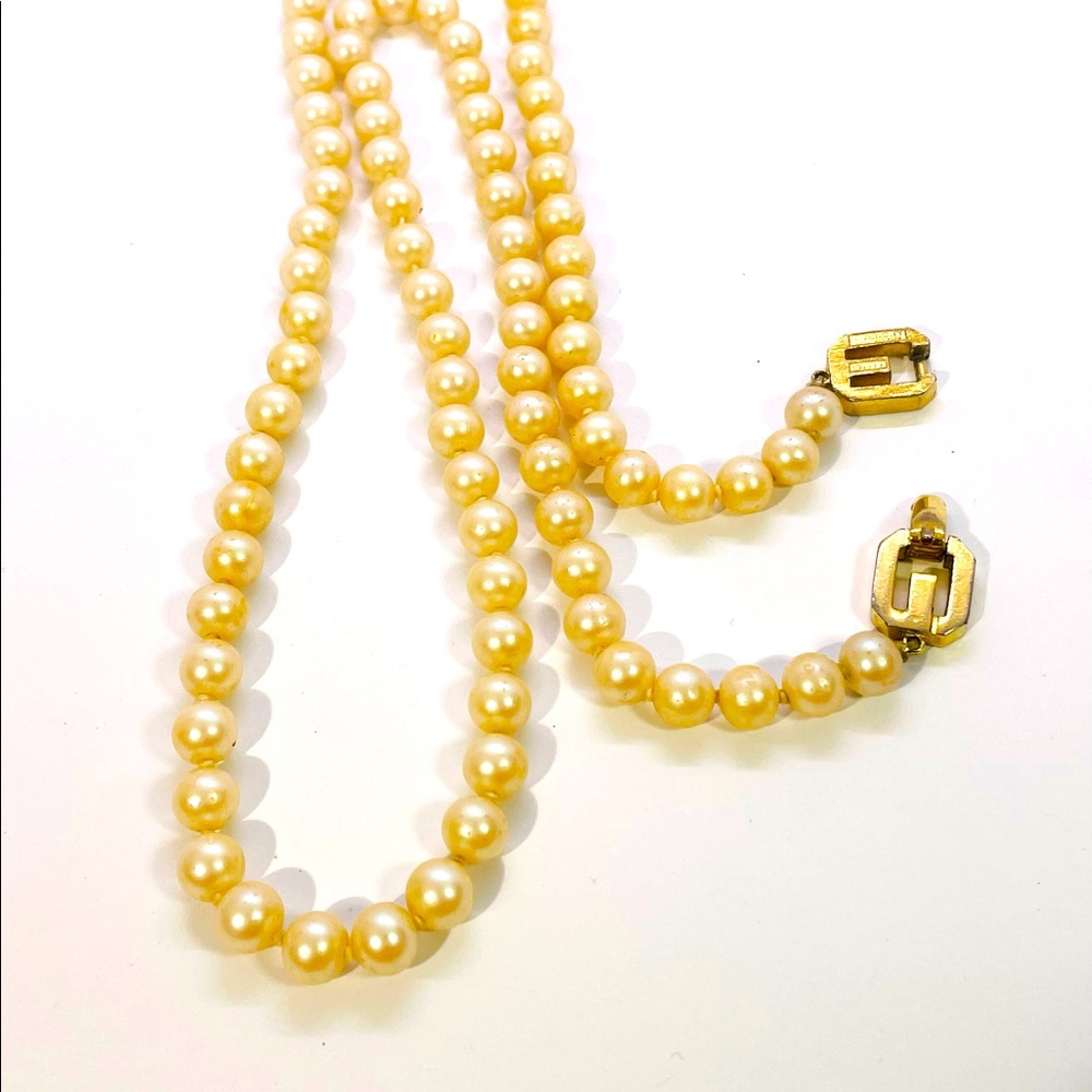 Vtg “Givenchy” 1977cream faux pearl hand knotted 26” necklace (showing wear)